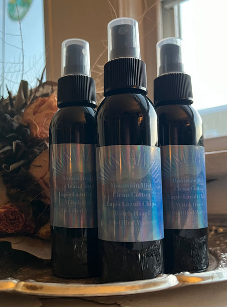 Bottles of Mountain Mist Room and Body Spray