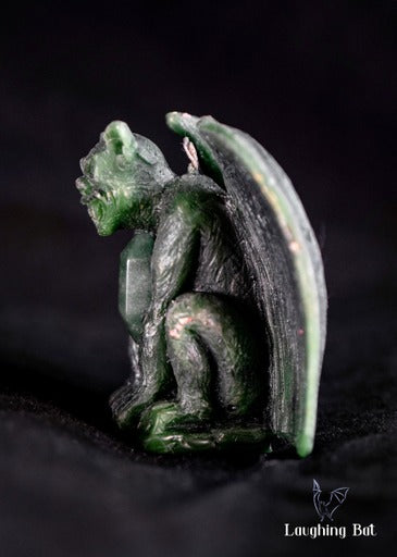 side view Emerald Green beeswax gargoyle with double terminated aventurine crystal