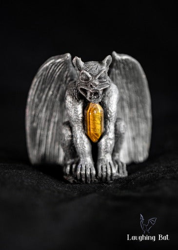 Black shimmering beeswax gargoyle with tigers eye double terminated crystal