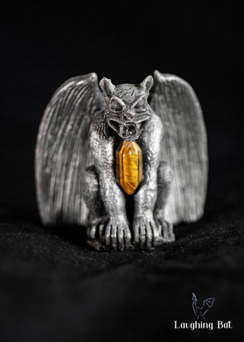 Black shimmering beeswax gargoyle with tigers eye double terminated crystal