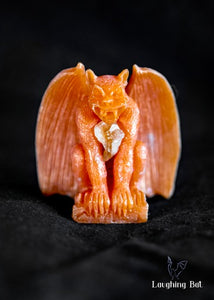 A Shimmering orange Beeswax Gargoyle with Citrine Crystal Chips